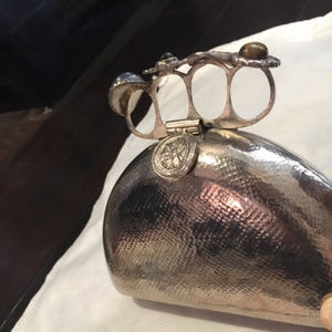 From St Xavier Silver Brass Clutch